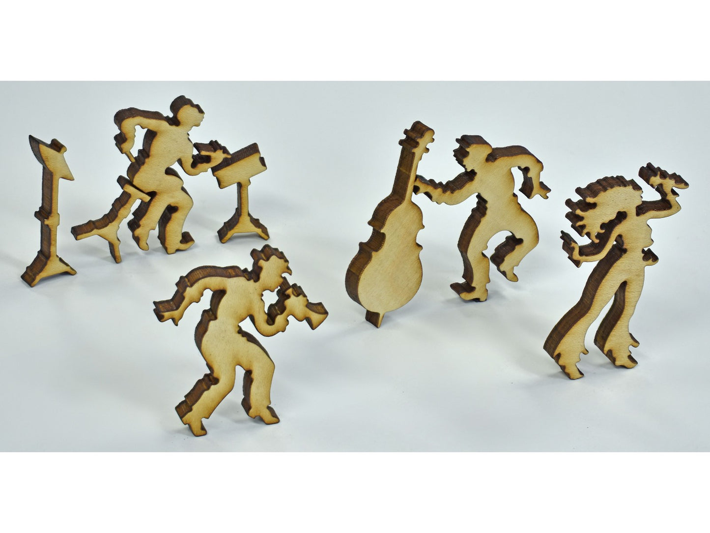 A closeup of pieces in the shape of a musical band.