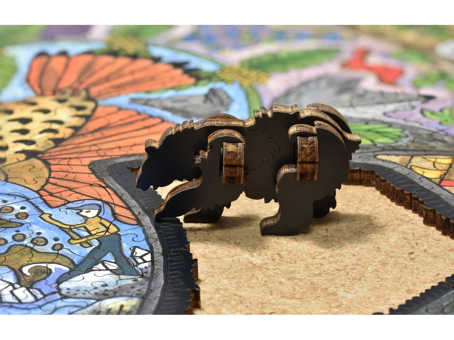 A closeup of pieces showing a three dimensional bear that can be made out of pieces in the puzzle, Black Bear.