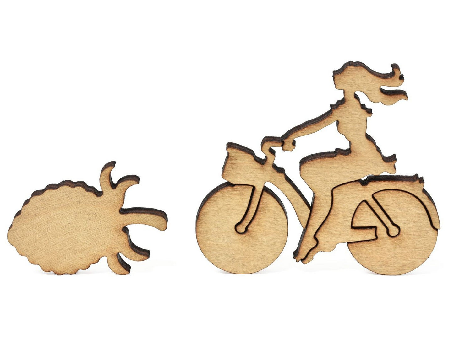 A closeup of pieces showing a woman on a bike and a strawberry.