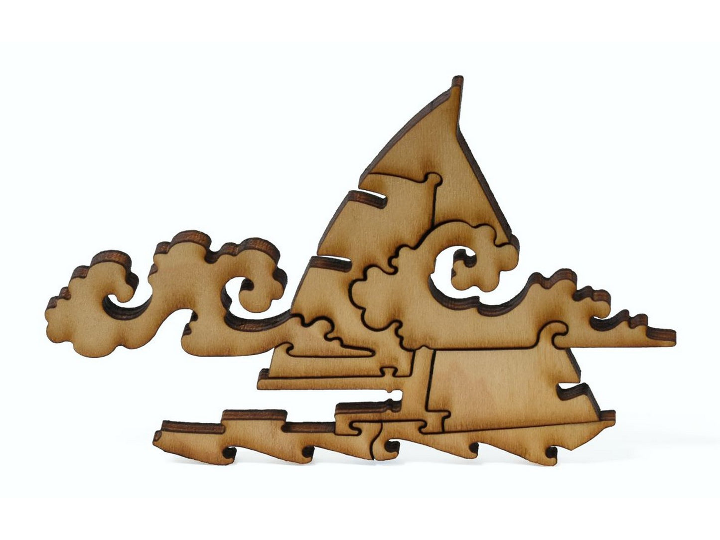 A closeup of pieces showing a multi-piece sailboat with clouds.