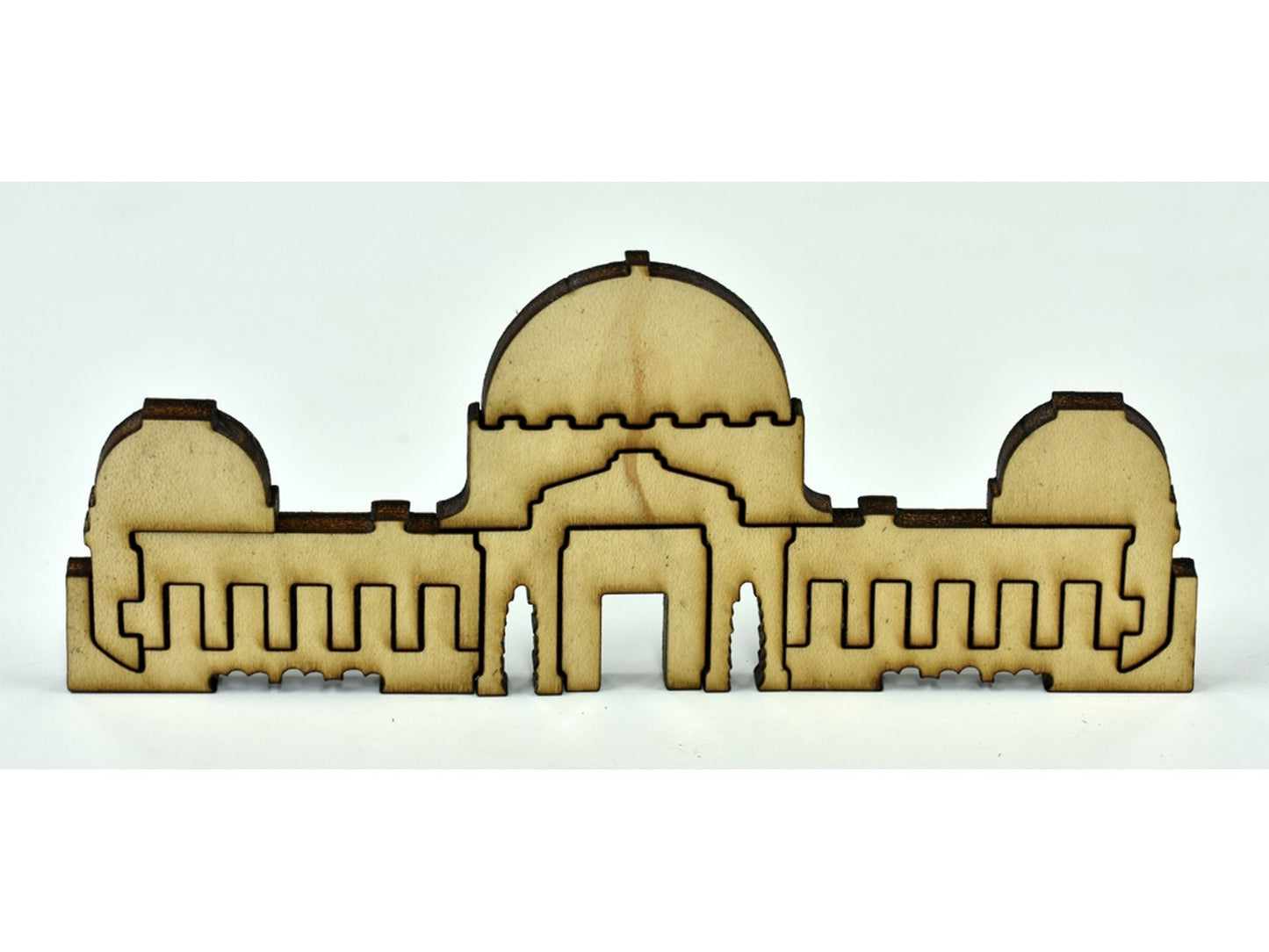 A closeup of pieces in the shape of a building.
