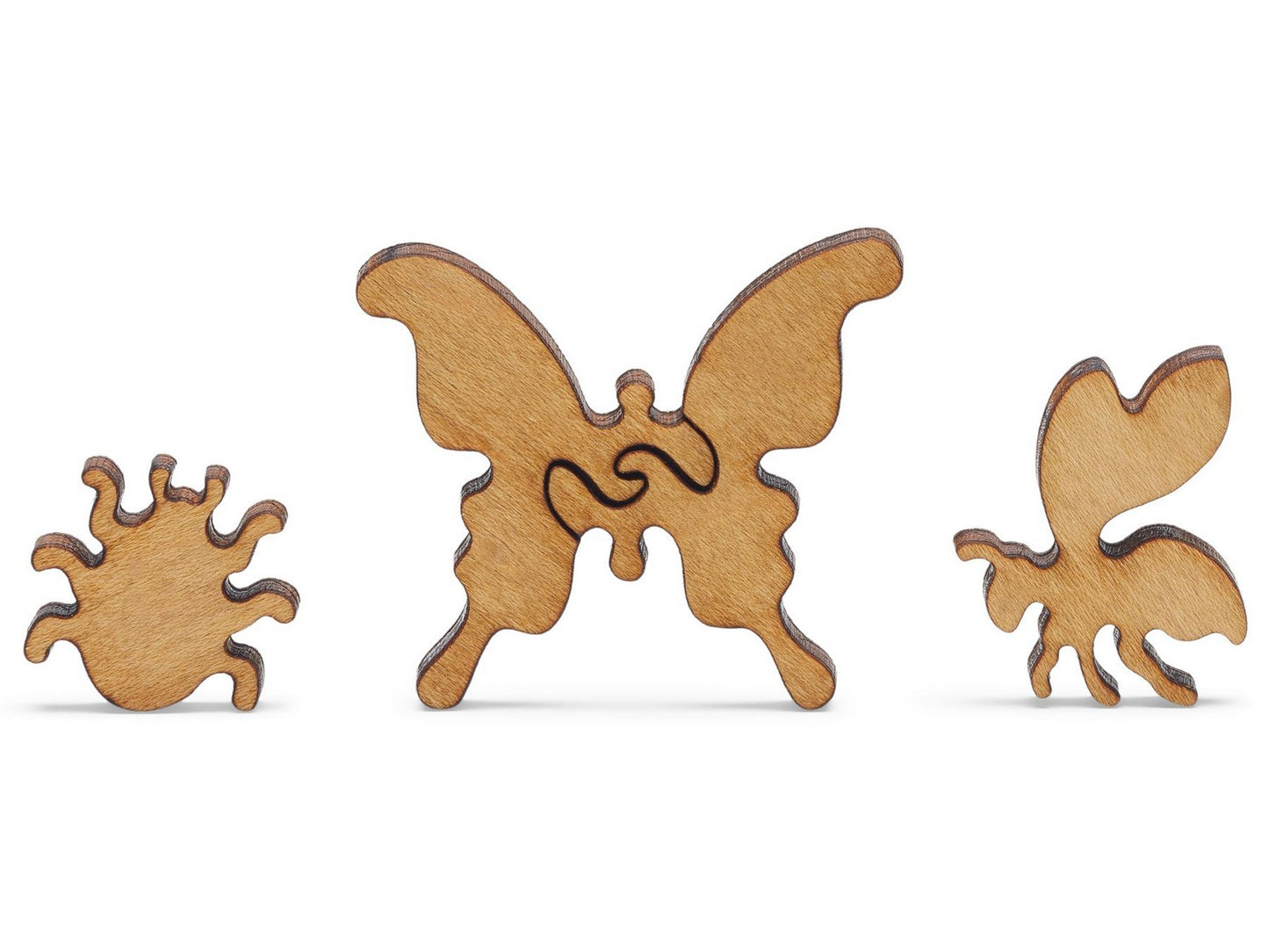 A closeup of pieces shaped like a bug, butterfly, and a bee.