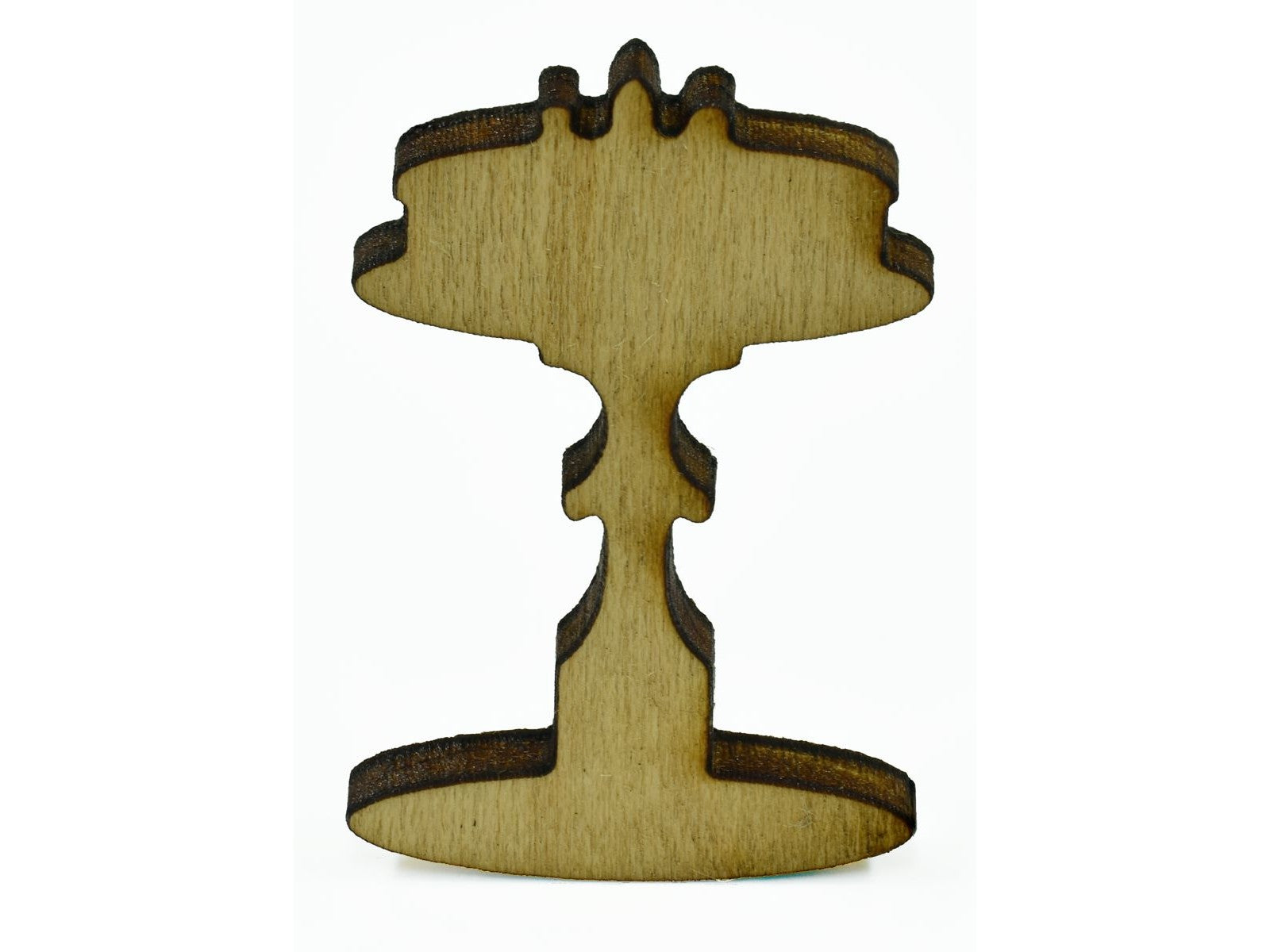 A closeup of a piece shaped like a cake on a stand.