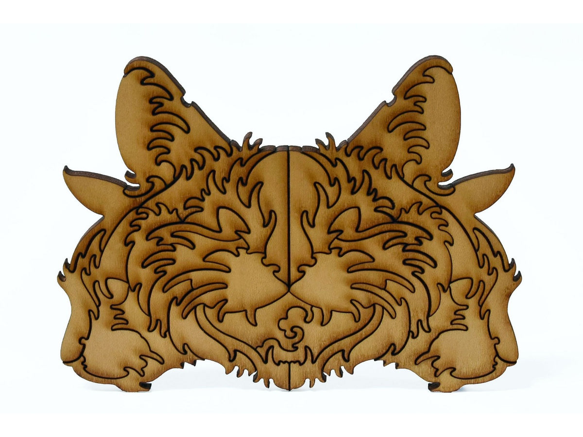 A closeup of pieces shaped like three large cat heads.