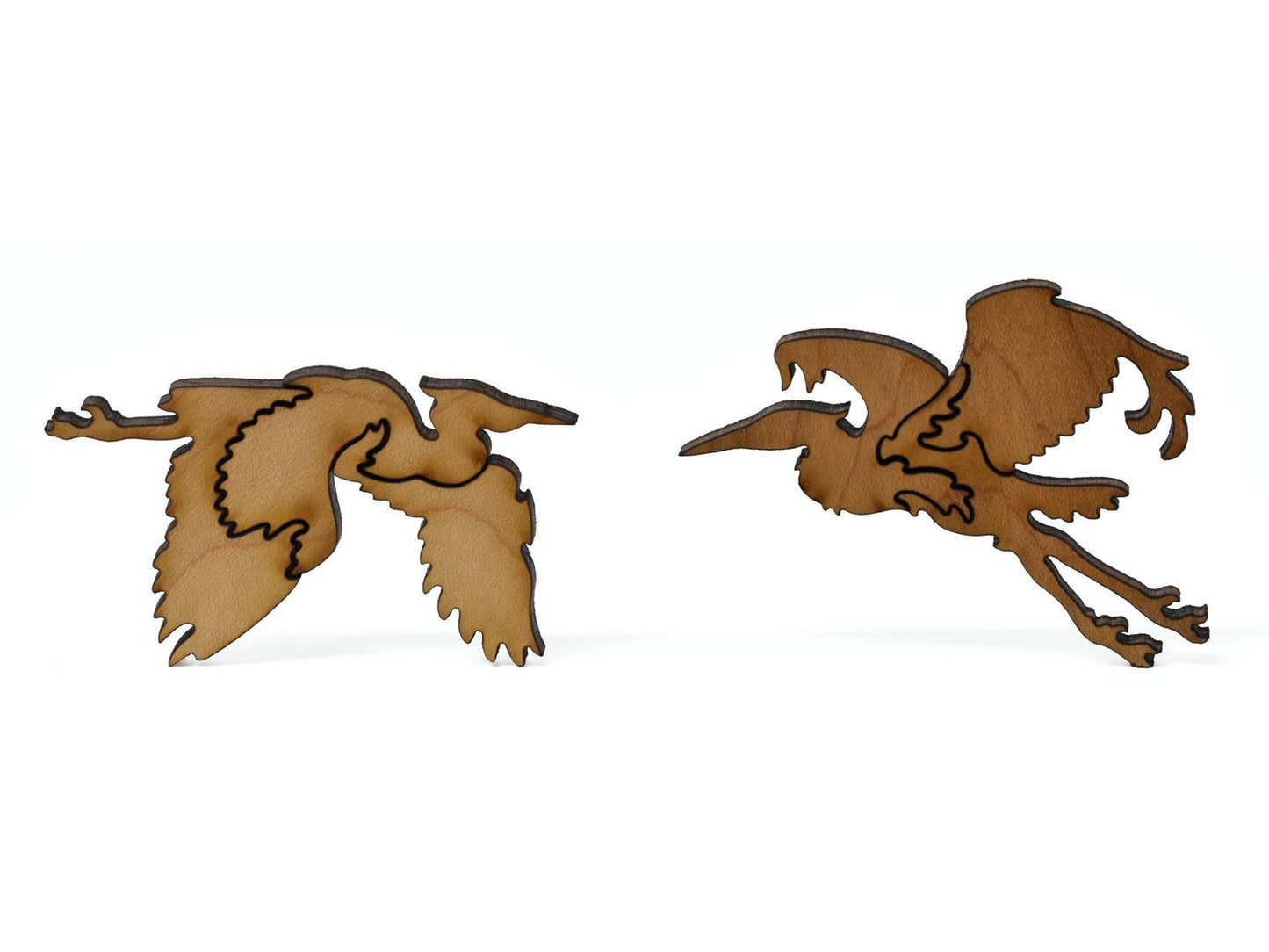 A closeup of pieces showing two egrets.