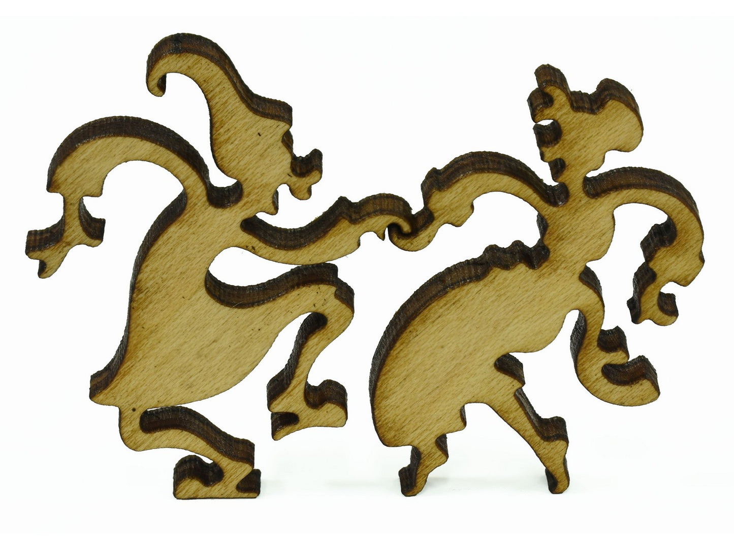 A closeup of pieces showing two people dancing in their nightgowns and caps.