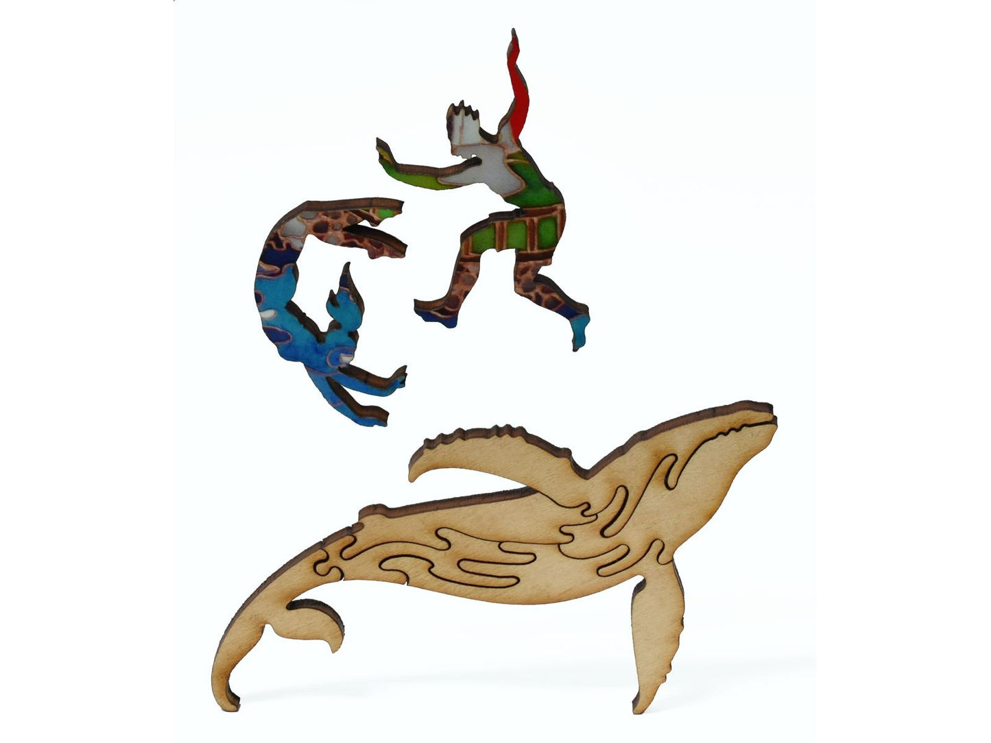 A closeup of pieces showing a multi-piece whale and two swimmers.