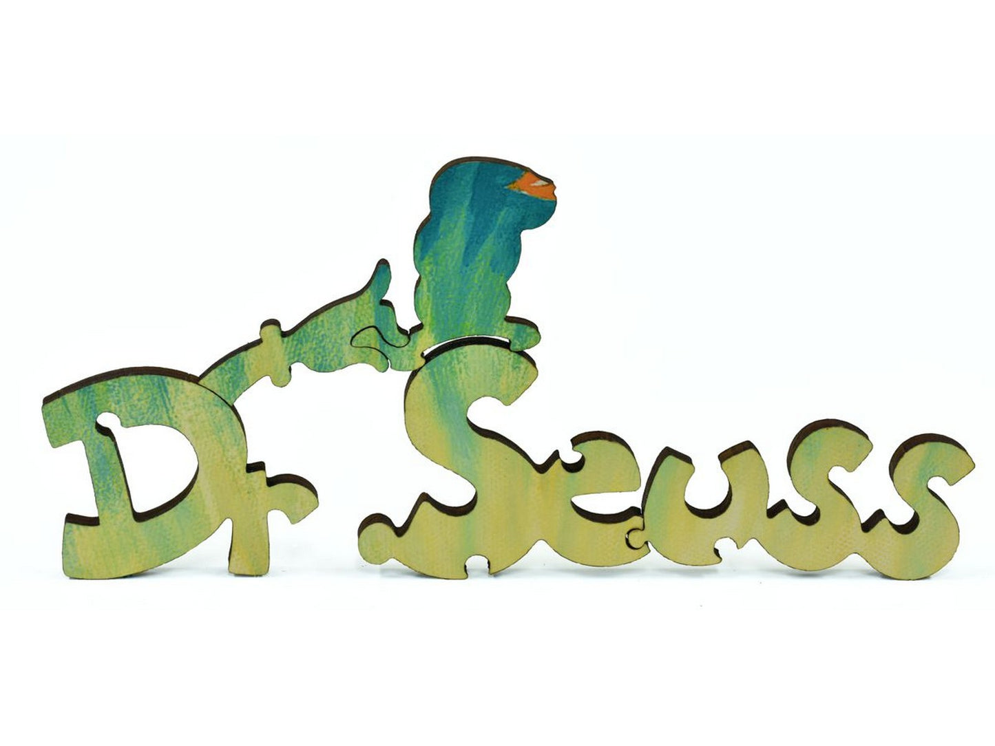 A closeup of pieces in the shape of Dr. Seuss's logo.