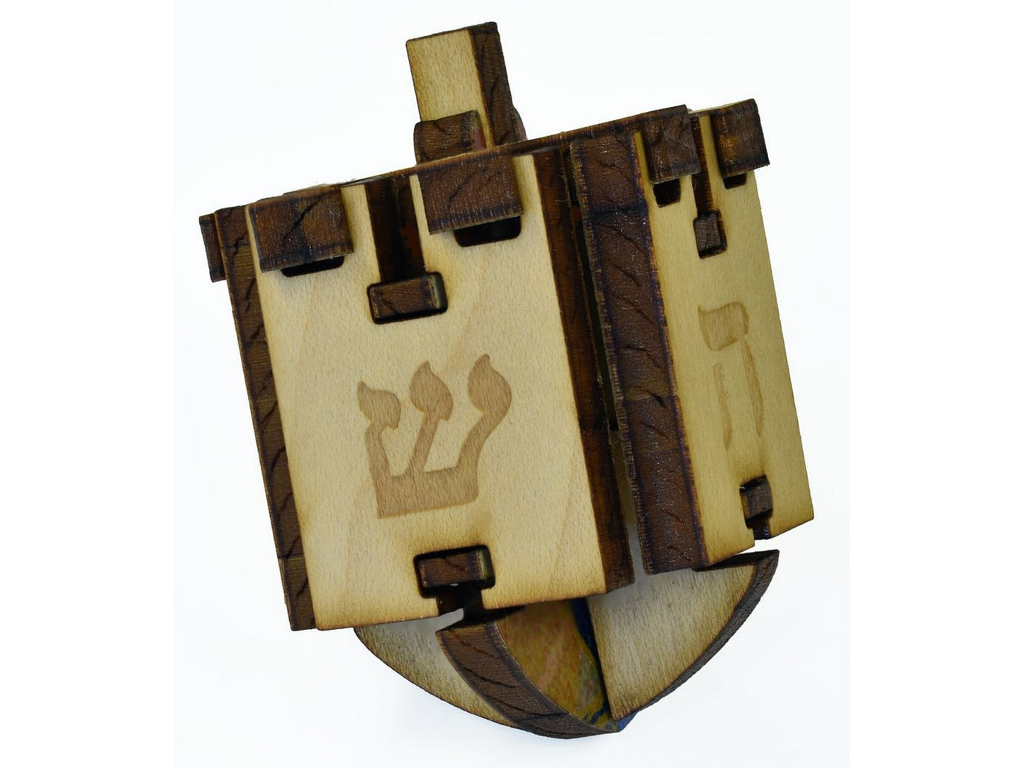 A closeup of pieces that go together to create a three dimensional dreidel that spins.