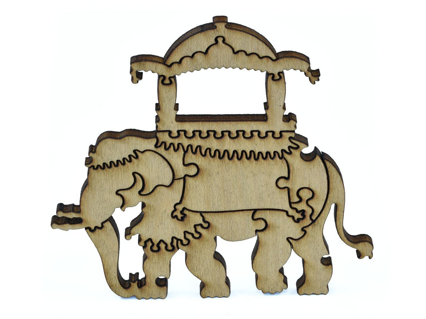 A closeup of pieces in the shape of an elephant with a saddle.