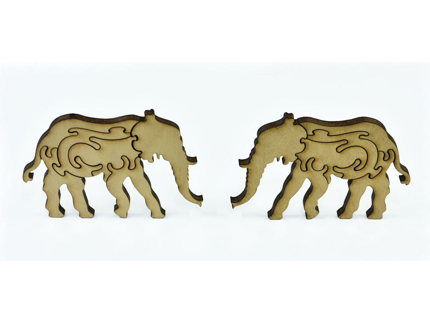 A closeup of pieces in the shape of two elephants.