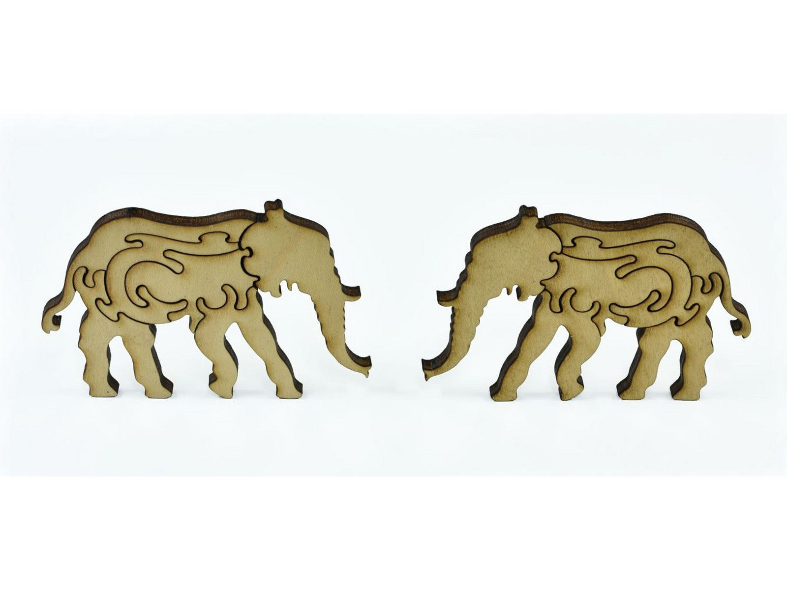 A closeup of pieces in the shape of two elephants.