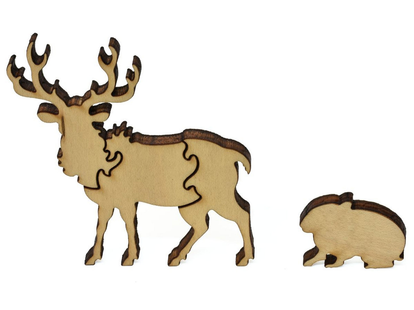 A closeup of pieces showing an elk and a marmot.