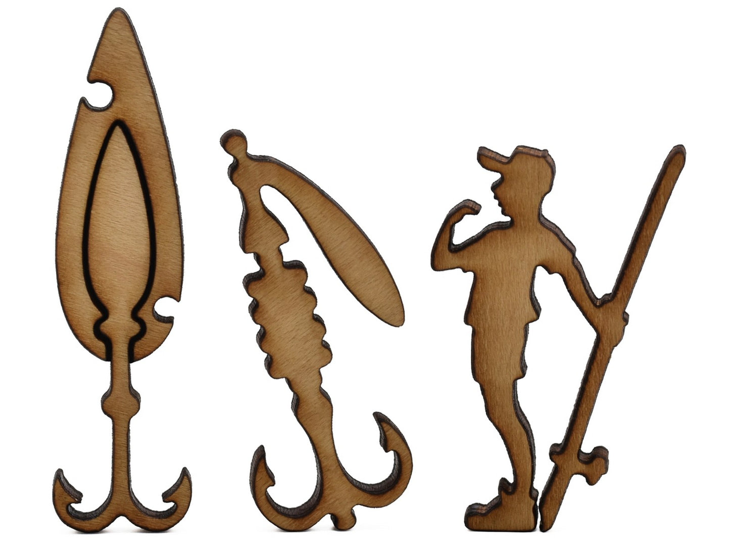 A closeup of pieces shaped like two fishing lures and a fisherman.