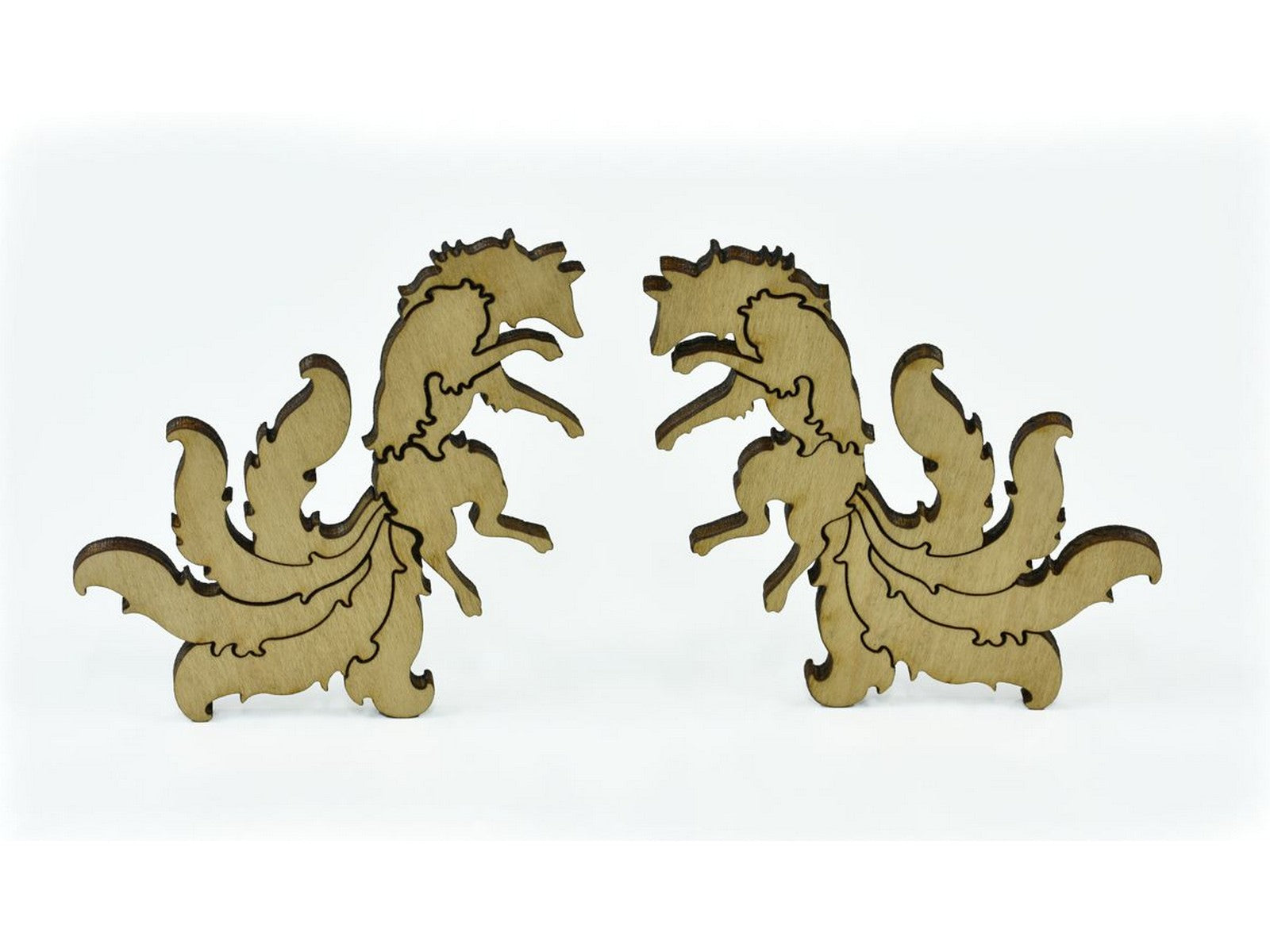 A closeup of pieces in the shape of foxes.