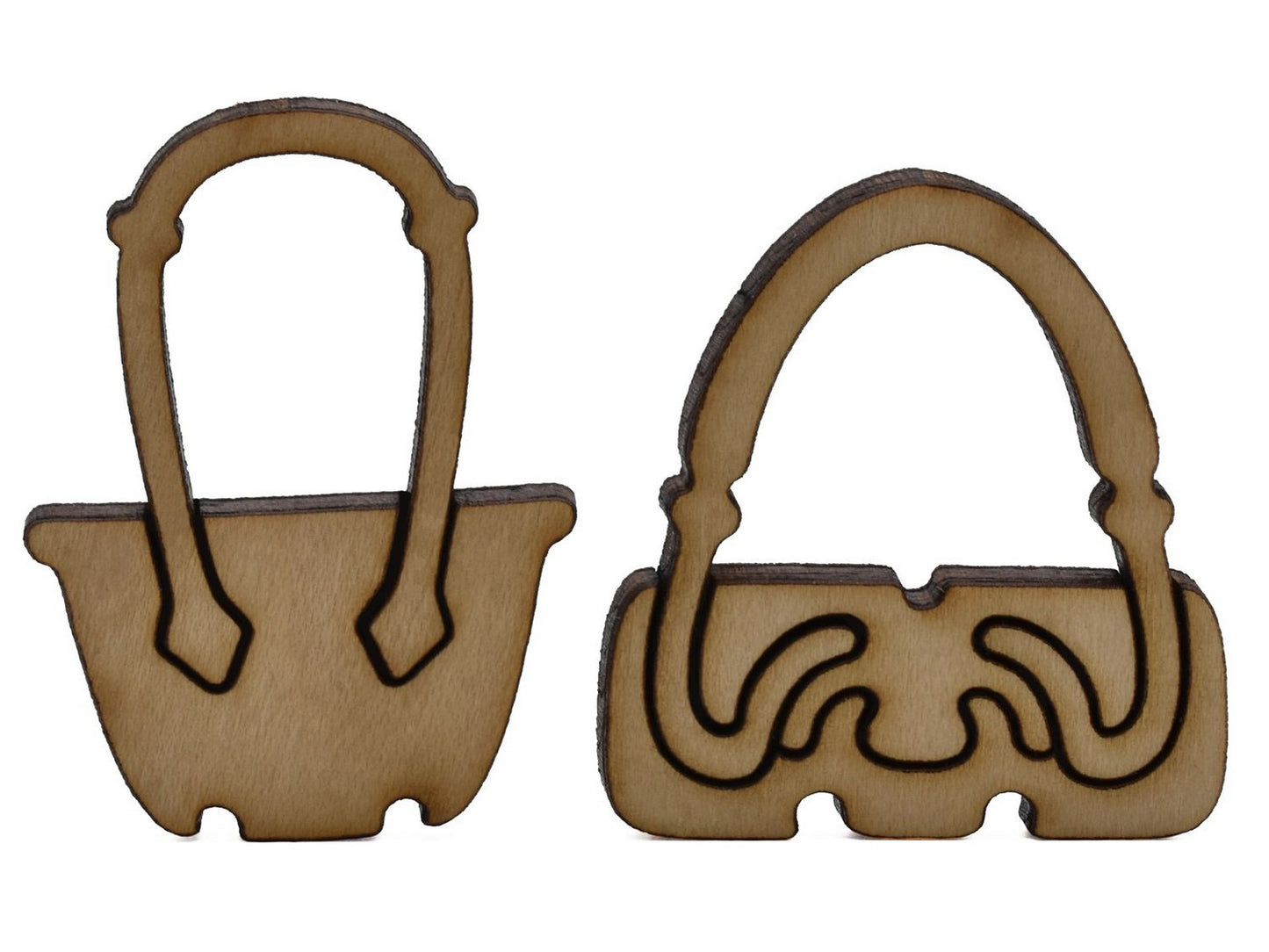 A closeup of pieces shaped like two handbags.
