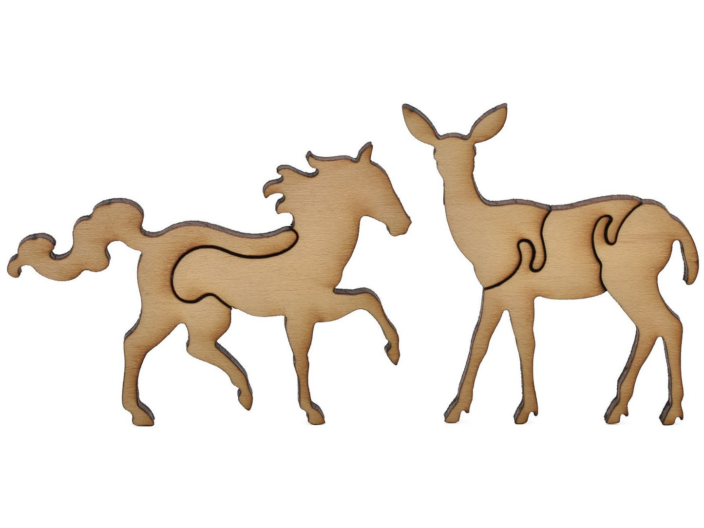 A closeup of pieces shaped like a horse and a deer.