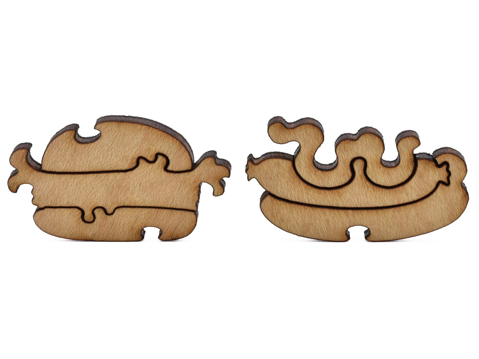 A closeup of pieces shaped like a hamburger and a hotdog.