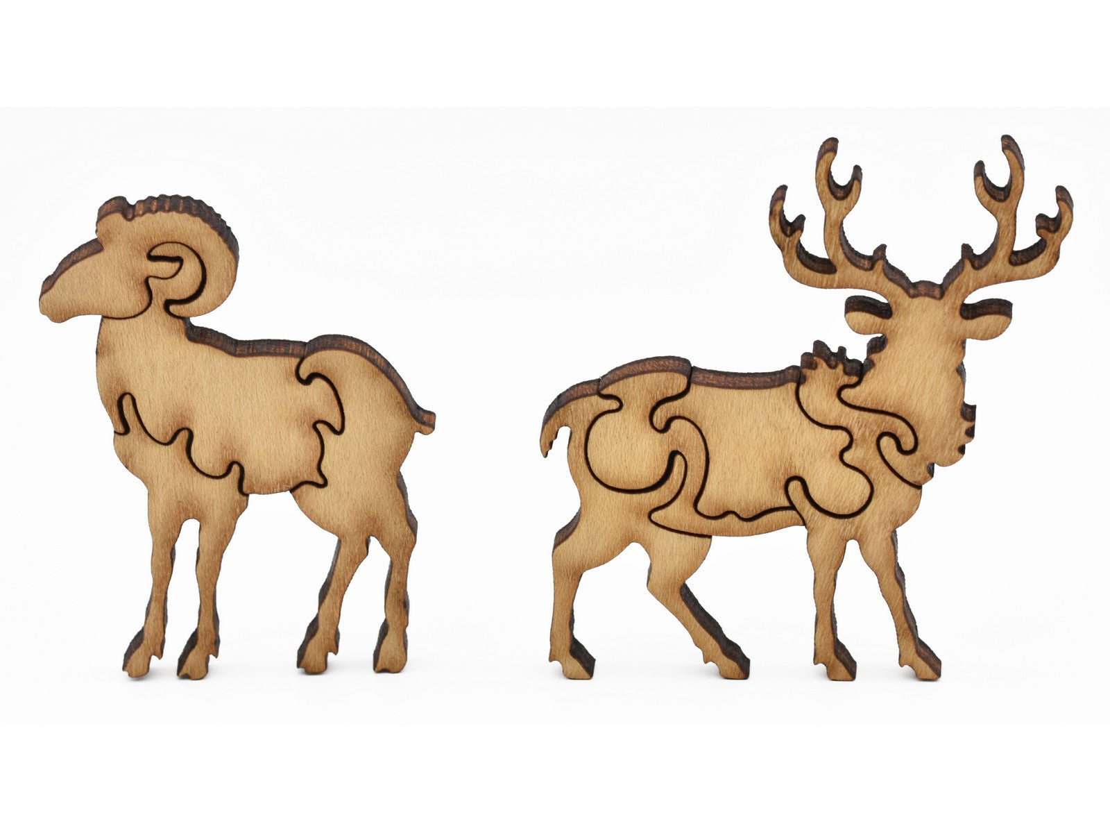 A closeup of pieces showing a buck and a ram.