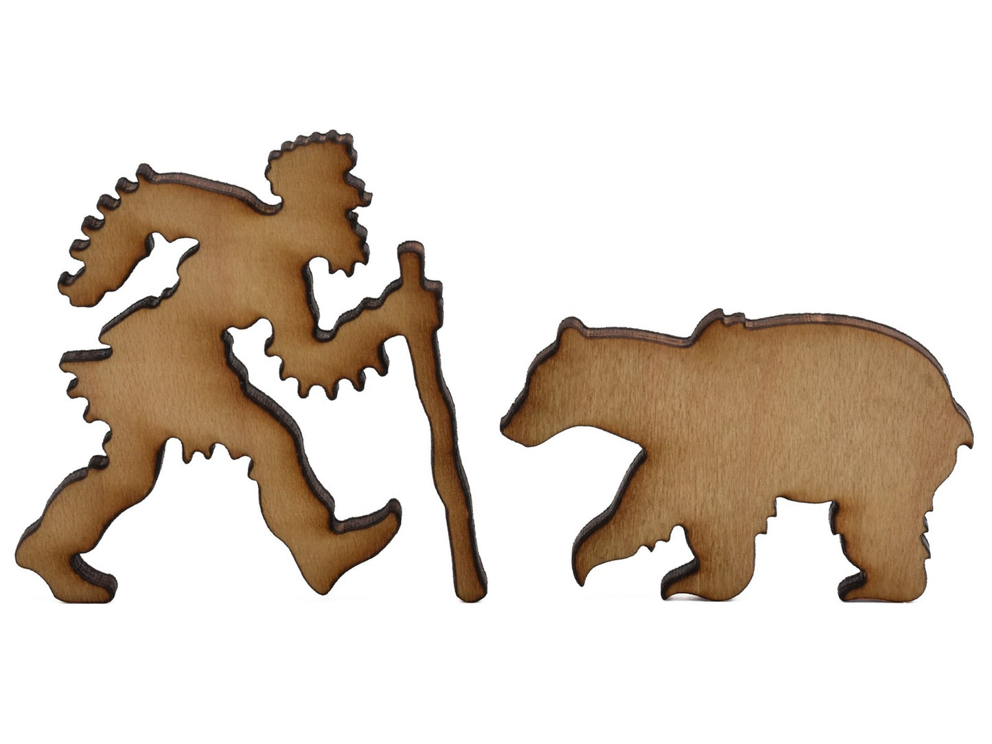 A closeup of pieces shaped like a mountain man and a bear.