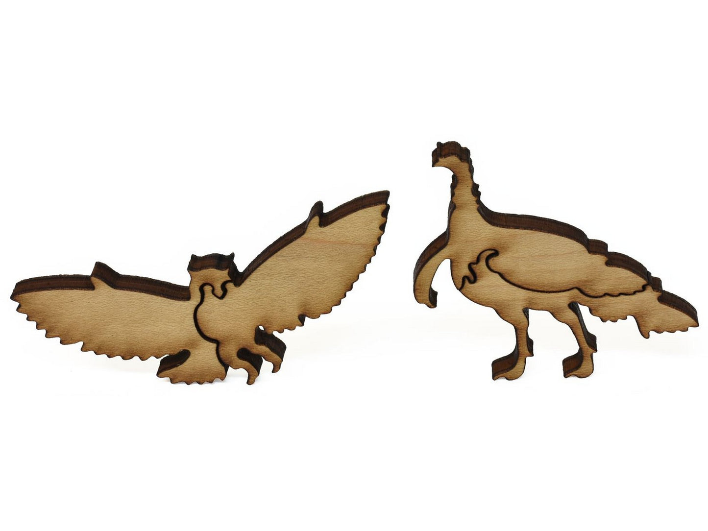 A closeup of pieces showing a turkey and an owl.