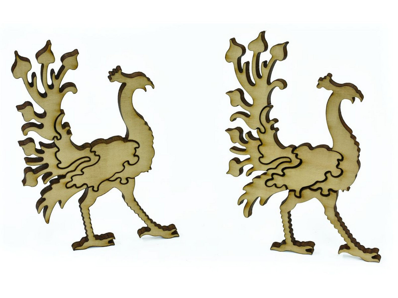 A closeup of pieces in the shape of peacocks.