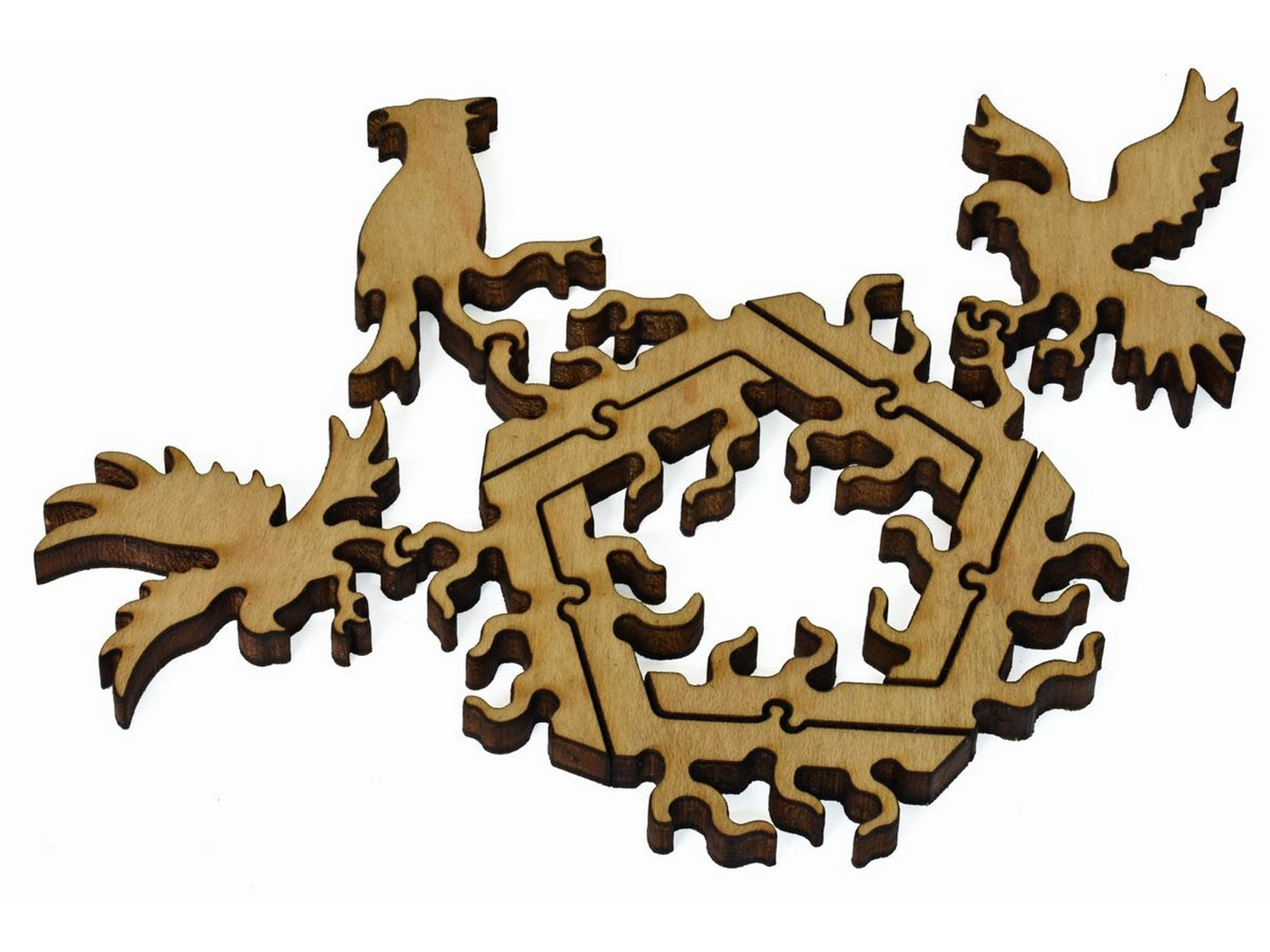 A closeup of pieces showing birds surrounding a pentagon of branches.