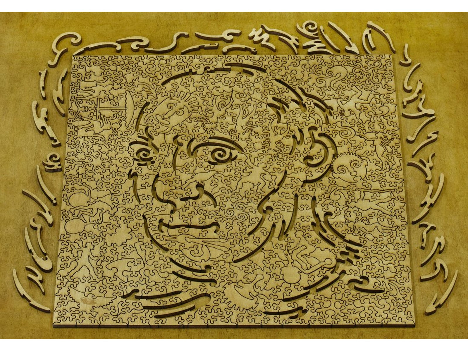 The back of the puzzle, Picasso's Studio, with pieces removed to reveal the Picasso Portrait Hidden Image.