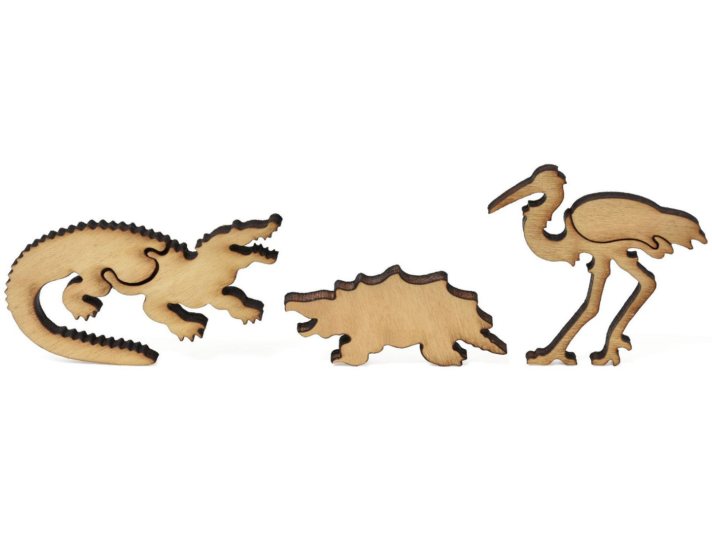 A closeup of pieces showing an alligator, snapping turtle, and egret.