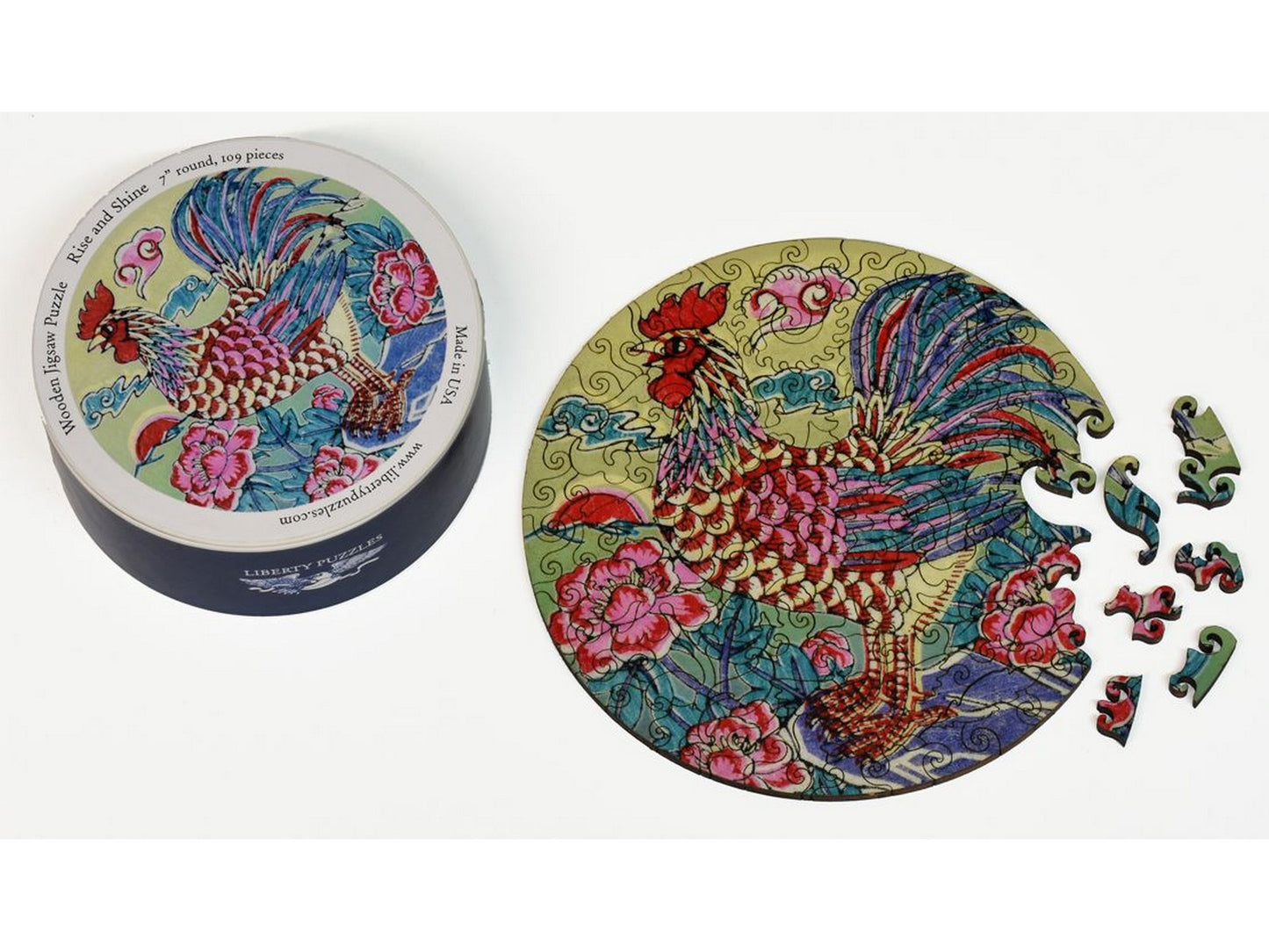 The puzzle, Rise and Shine, with the box that it comes in.