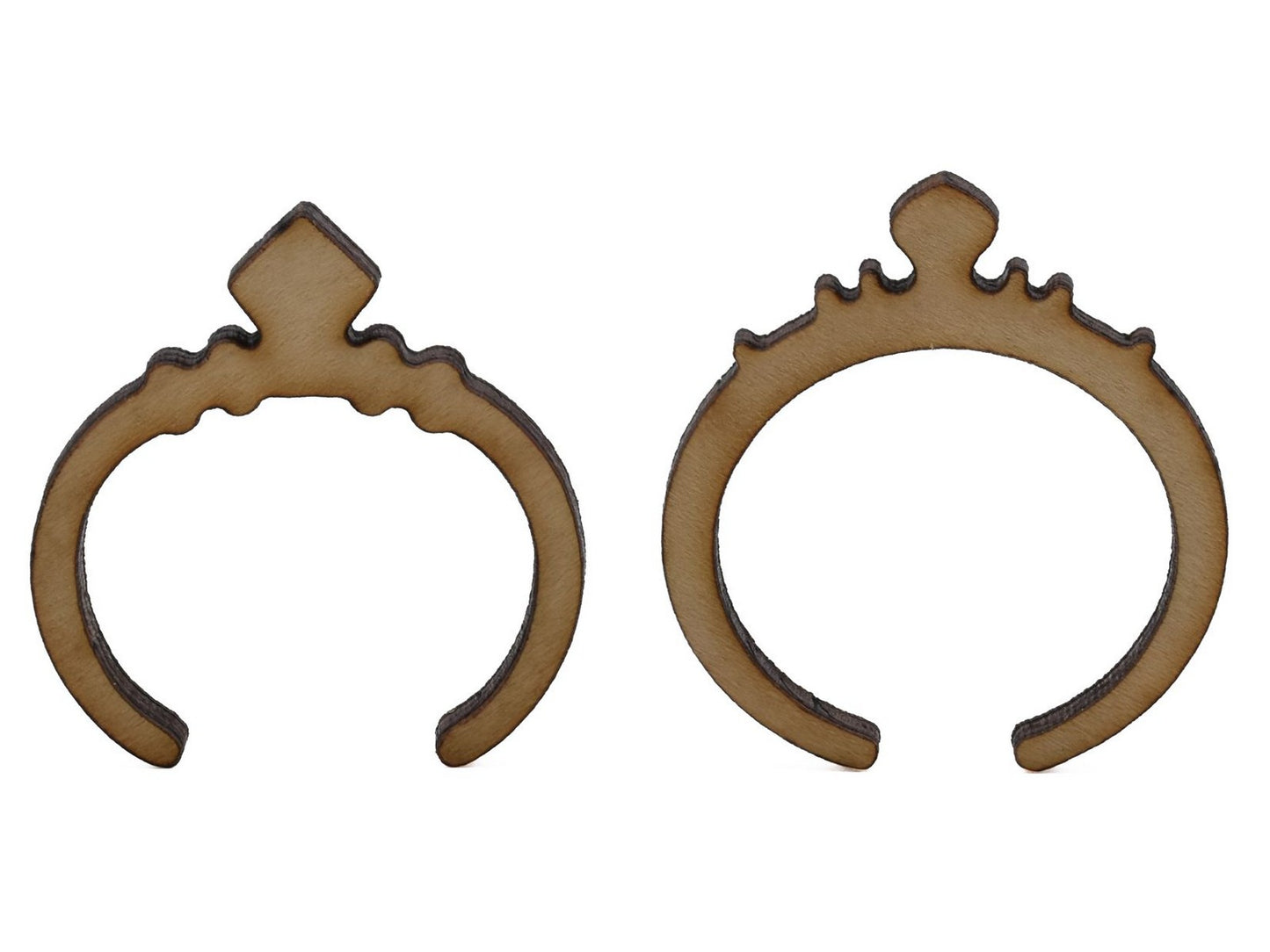 A closeup of pieces shaped like two diamond rings.