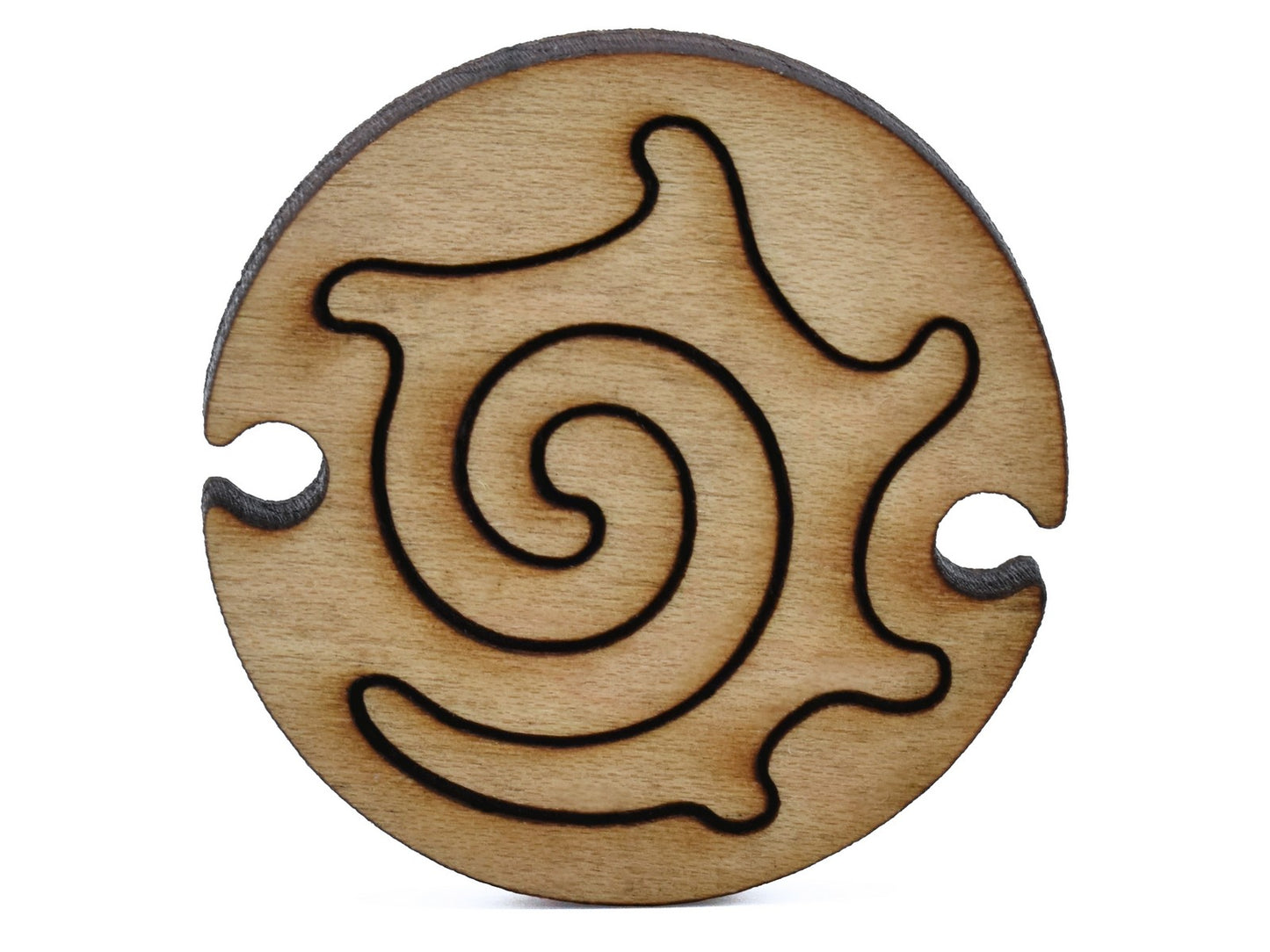A closeup of pieces shaped like a round nautilus.