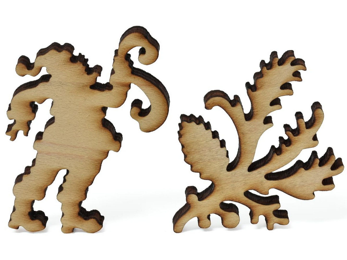 A closeup of pieces showing santa with his list as well as mistletoe and holly.