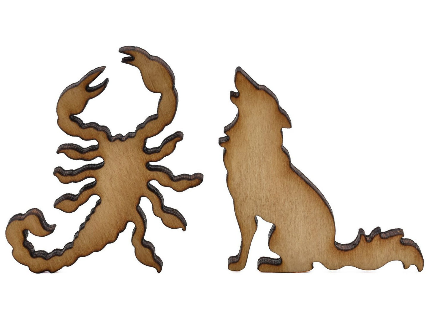 A closeup of pieces shaped like a scorpion and a coyote.