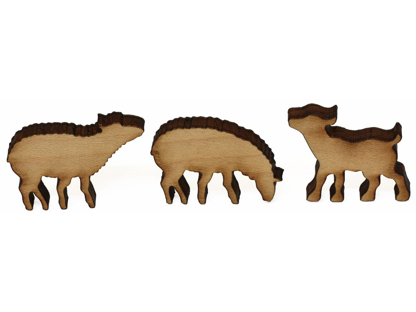 A closeup of pieces showing two sheep and a calf.