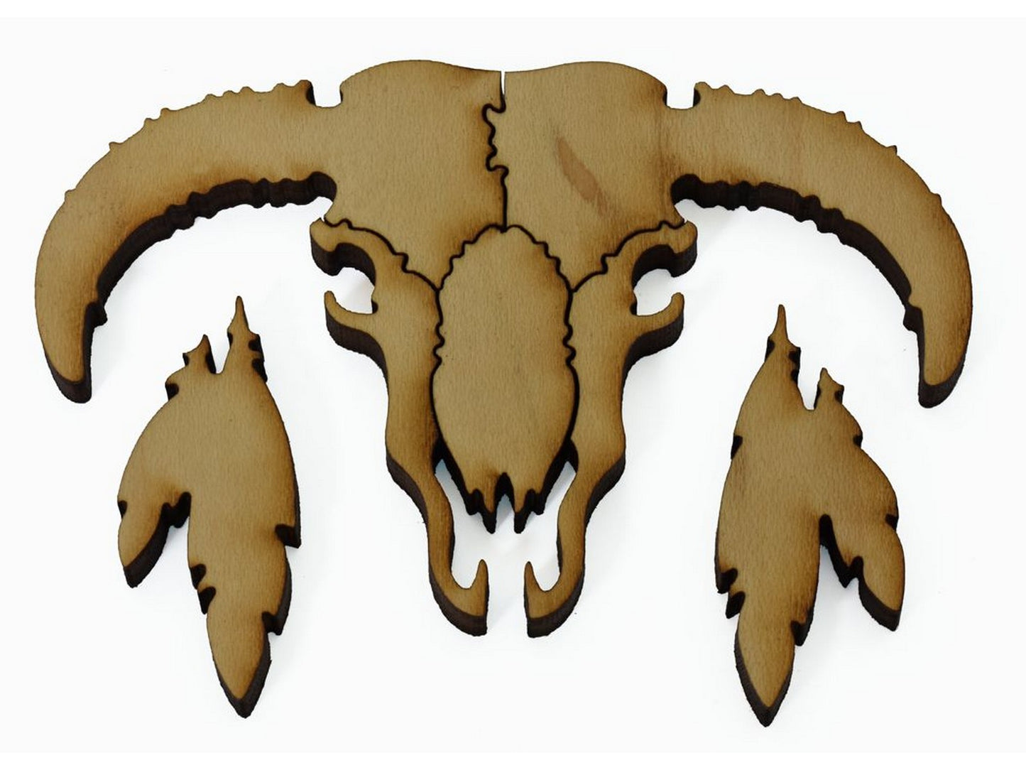 A closeup of pieces showing a skull and feathers.