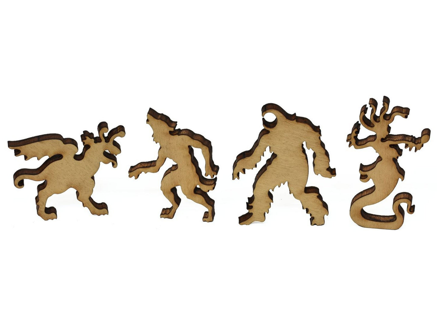 A closeup of pieces showing four beasts including a werewolf and medusa..