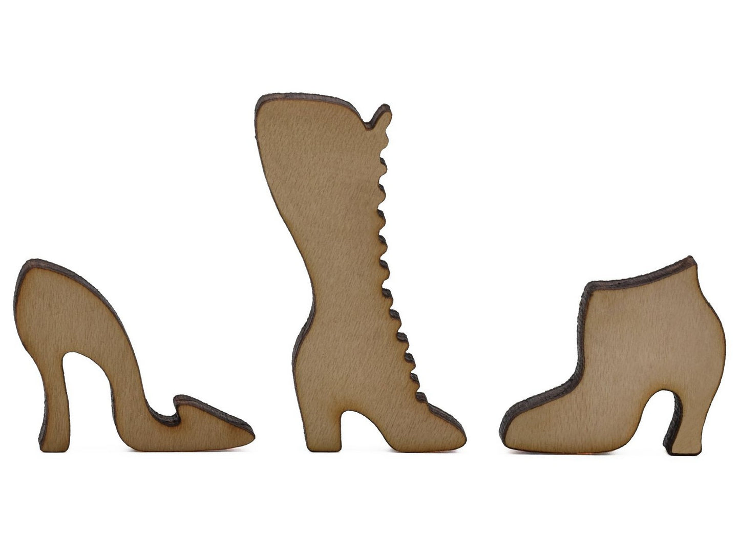 A closeup of pieces shaped like three different styles of shoes.