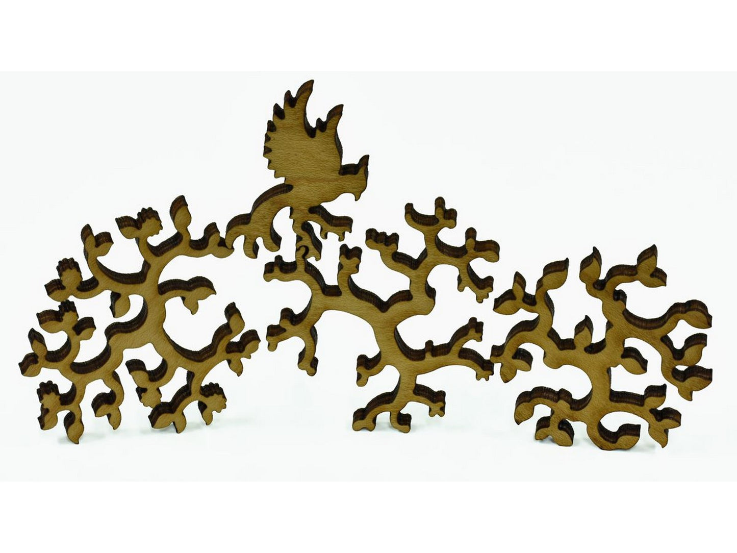 A closeup of pieces shaped like a bird and round branches.