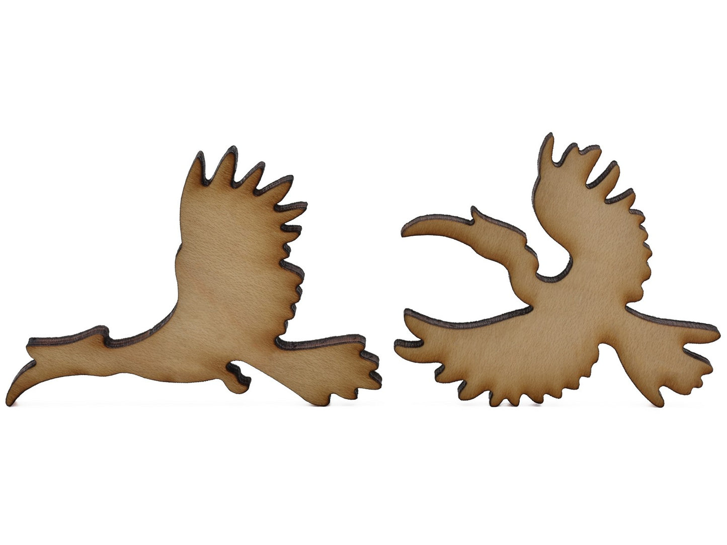 A closeup of pieces shaped like two hornbills.