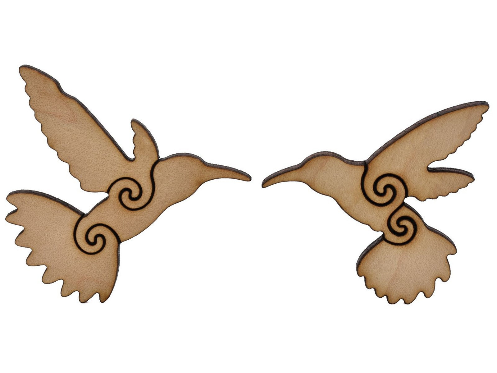 A closeup of pieces shaped like two hummingbirds.