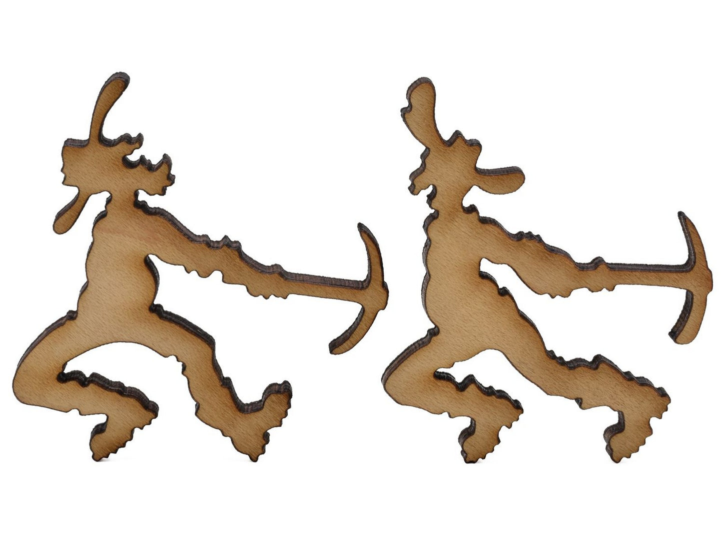 A closeup of pieces shaped like two miners.