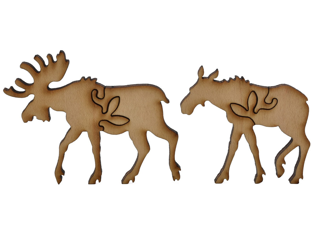 A closeup of pieces shaped like two moose.