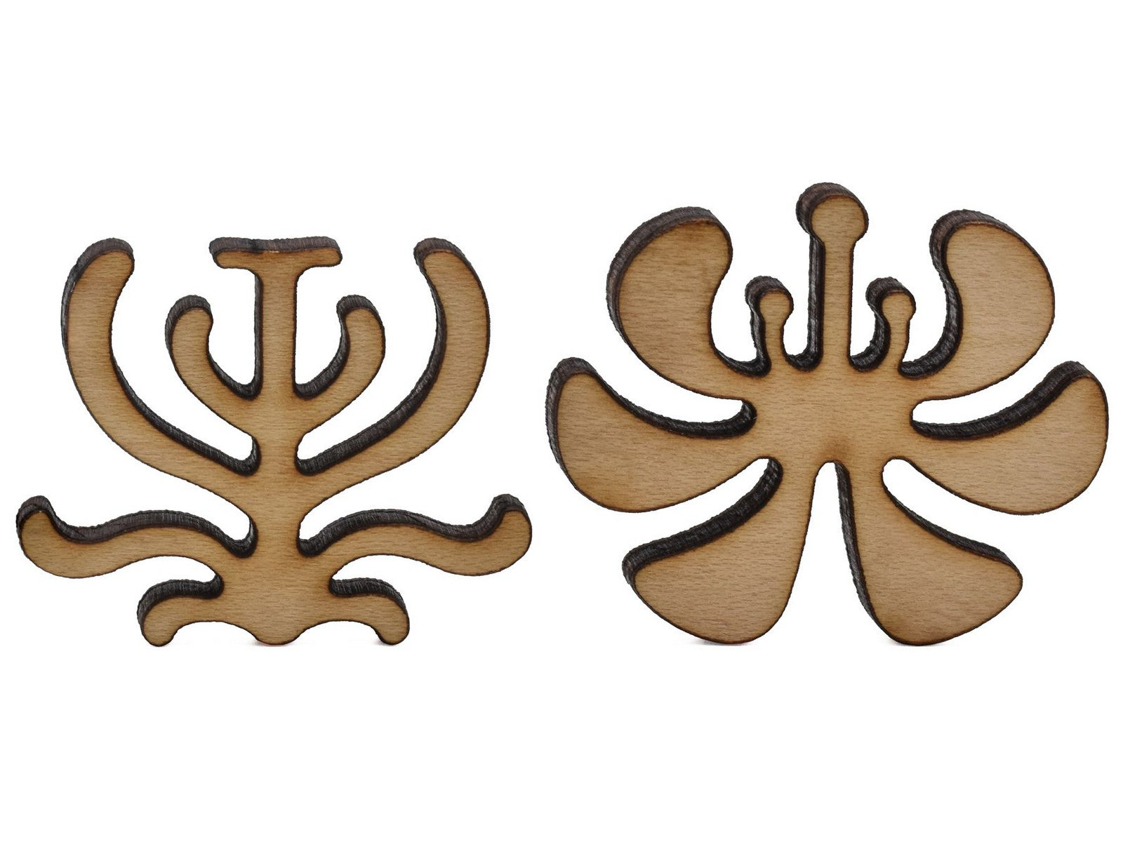 A closeup of pieces shaped like two stylized plants.