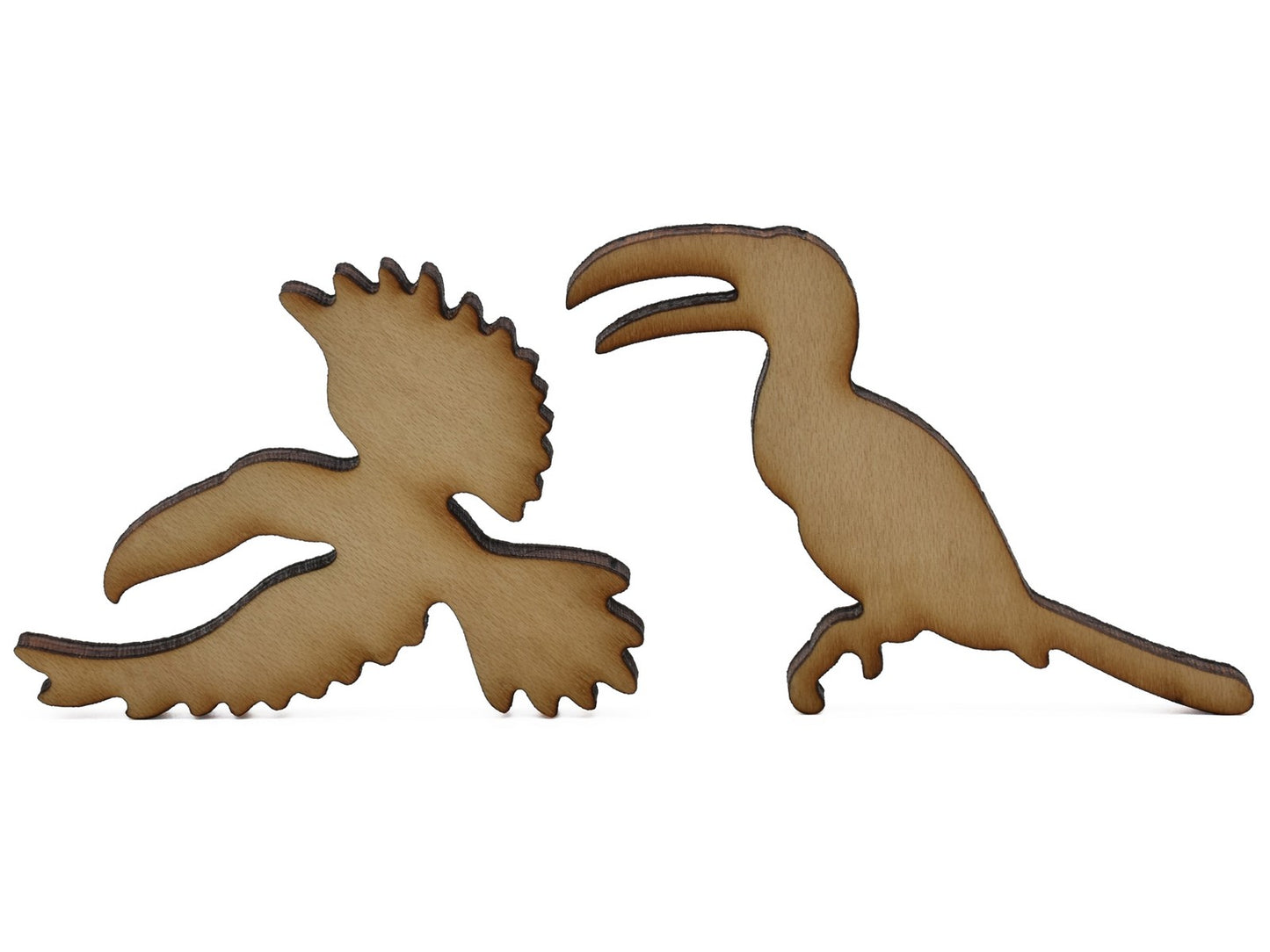 A closeup of pieces shaped like two toucans.