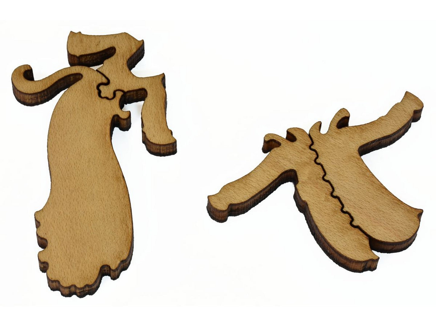 A closeup of pieces shaped like a dress and a shirt.
