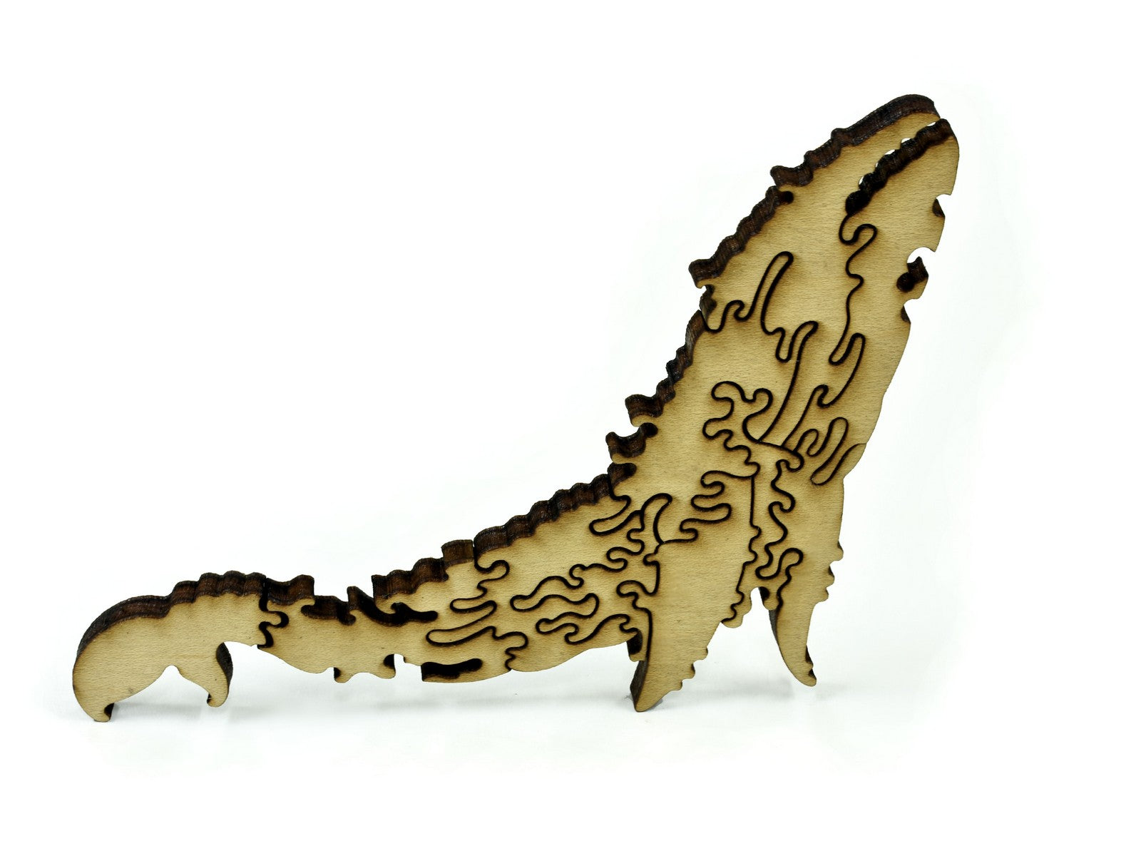 A closeup of pieces in the shape of a whale.