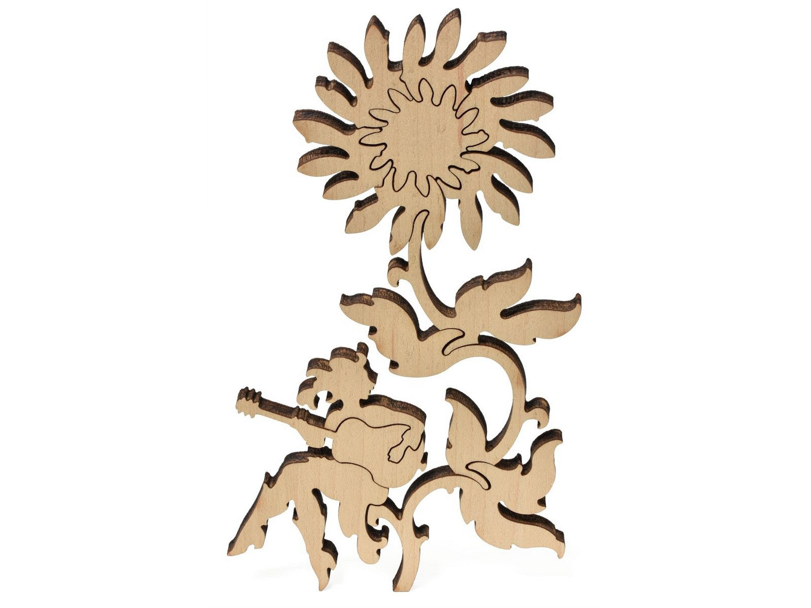 A closeup of pieces showing a woman playing guitar while sitting on a giant flower from the puzzle, How the West Was One.