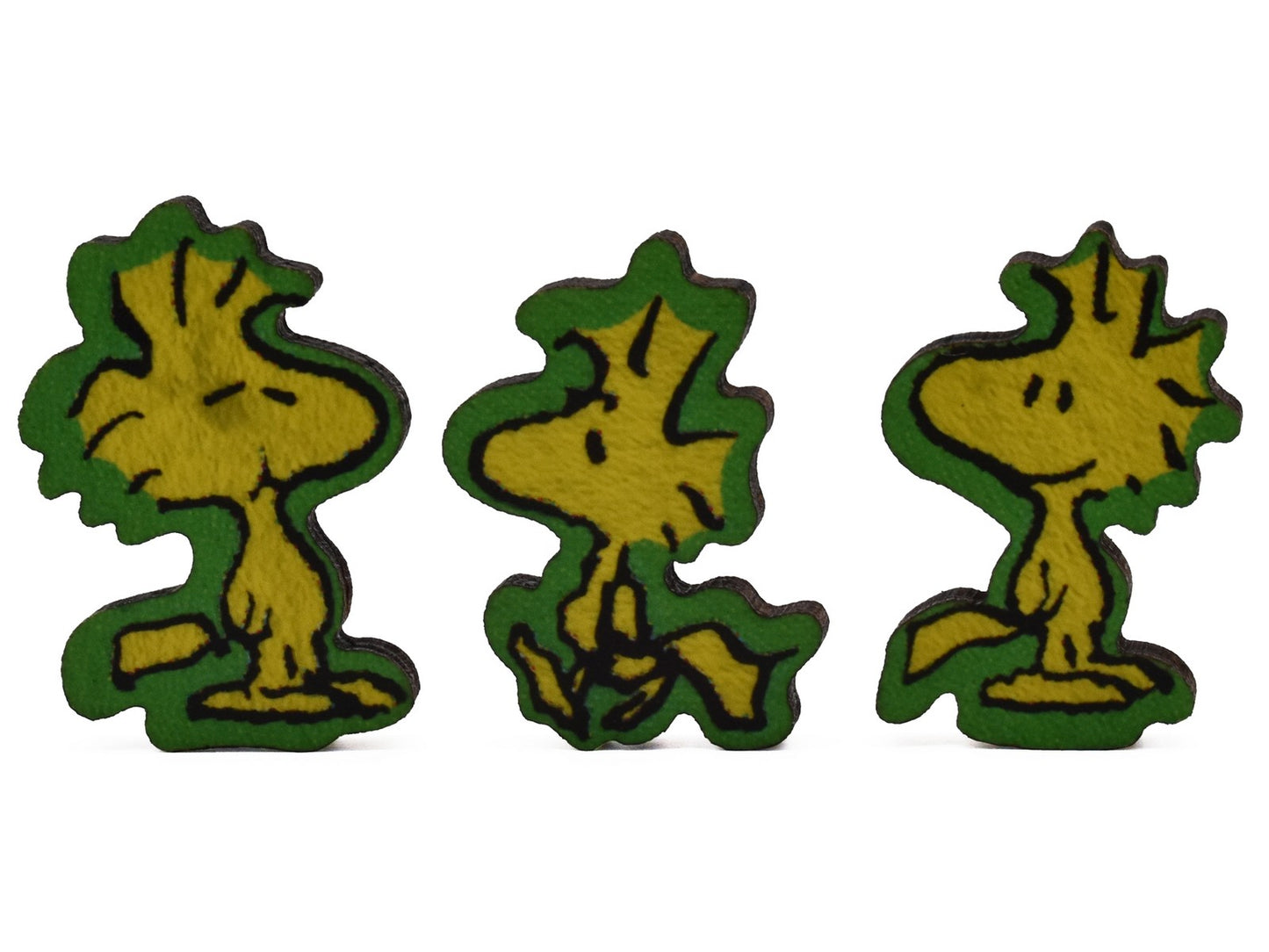 A closeup of pieces shaped like Woodstock and his friends.