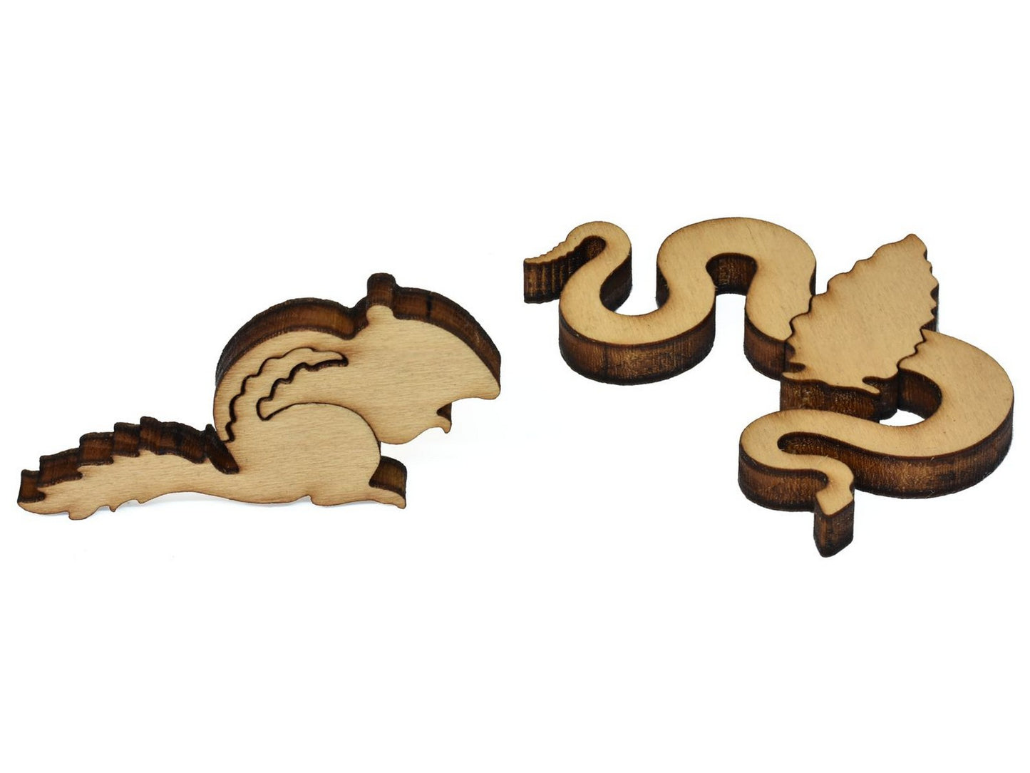 A closeup of pieces showing a chipmunk and a snake wrapped around an arrowhead.